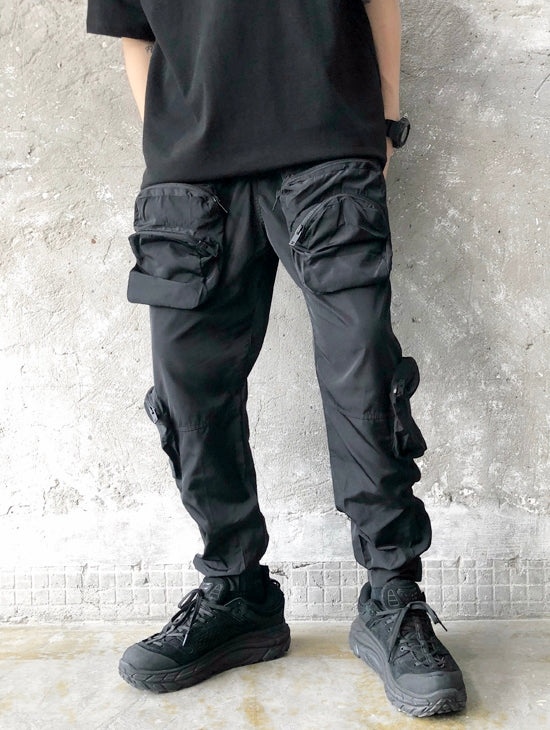 Track pants with outlet pockets